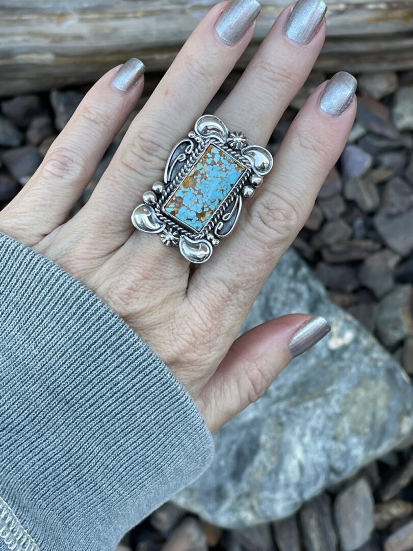 Handmade rectangle Cut Royston Turquoise Ring with Scroll and Twist Detail Ring in Middle Finger