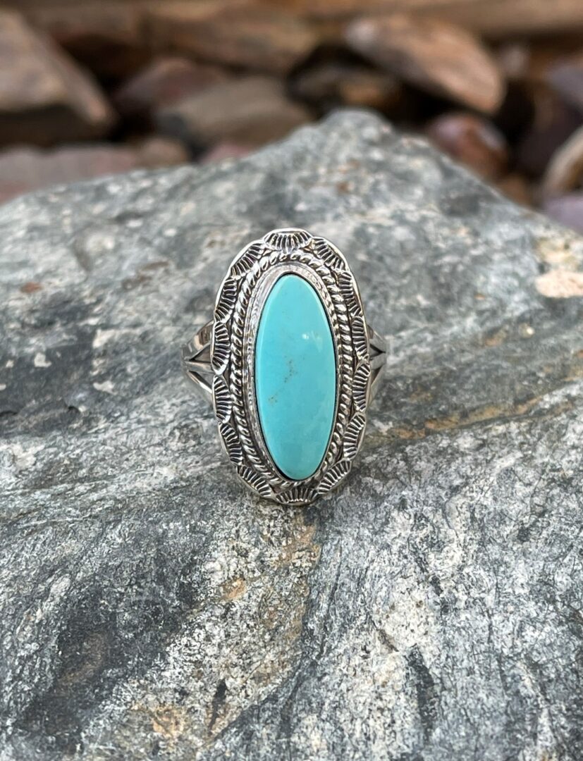 Oval Sterling Silver Kingman Turquoise Ring with Stamped Trim